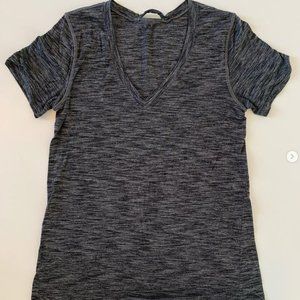 Lululemon size 4 t shirt. silver technology. Charcoal in color.